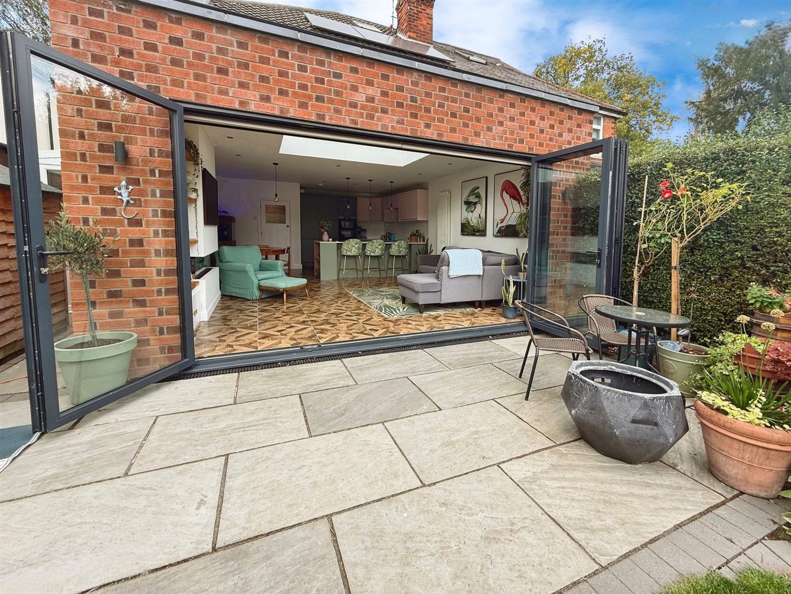 Rear extension opened onto a garden terrace